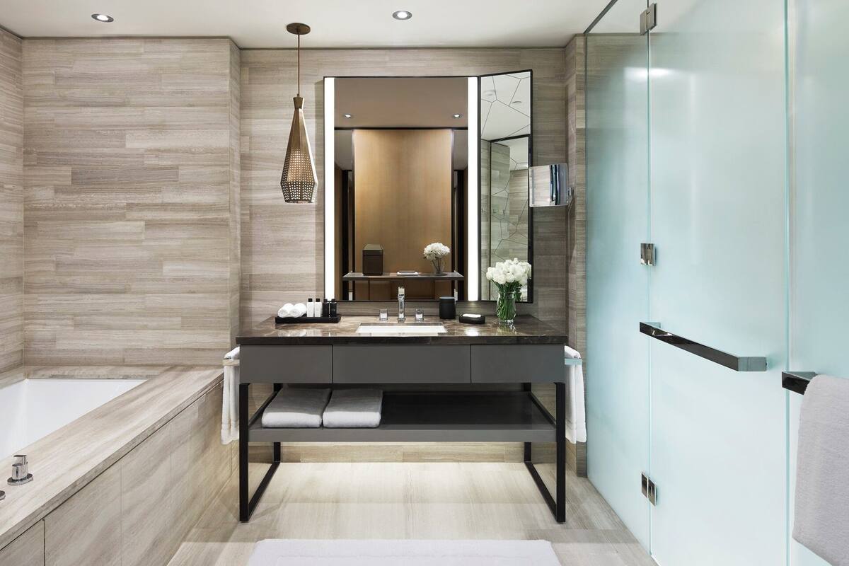 separate bathtub and shower, deep-soaking bathtub, rainfall showerhead