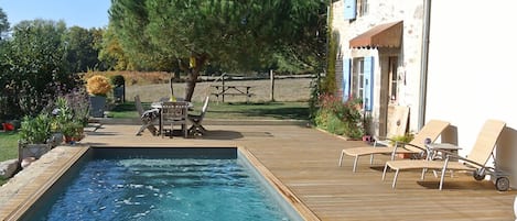 Seasonal outdoor pool, pool umbrellas, pool loungers