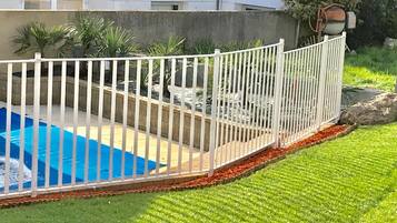 Seasonal outdoor pool, open 10:00 AM to 6:00 PM, pool umbrellas