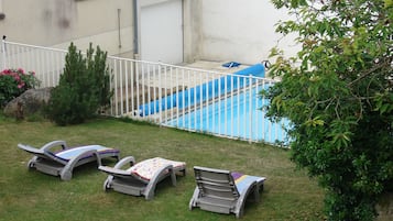 Seasonal outdoor pool, open 10:00 AM to 6:00 PM, pool umbrellas