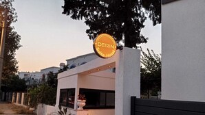 A modern hotel with a prominent sign reading "DERIN Luxury Hotel". - Derin Apart Hotel Bodrum (Bodrum)