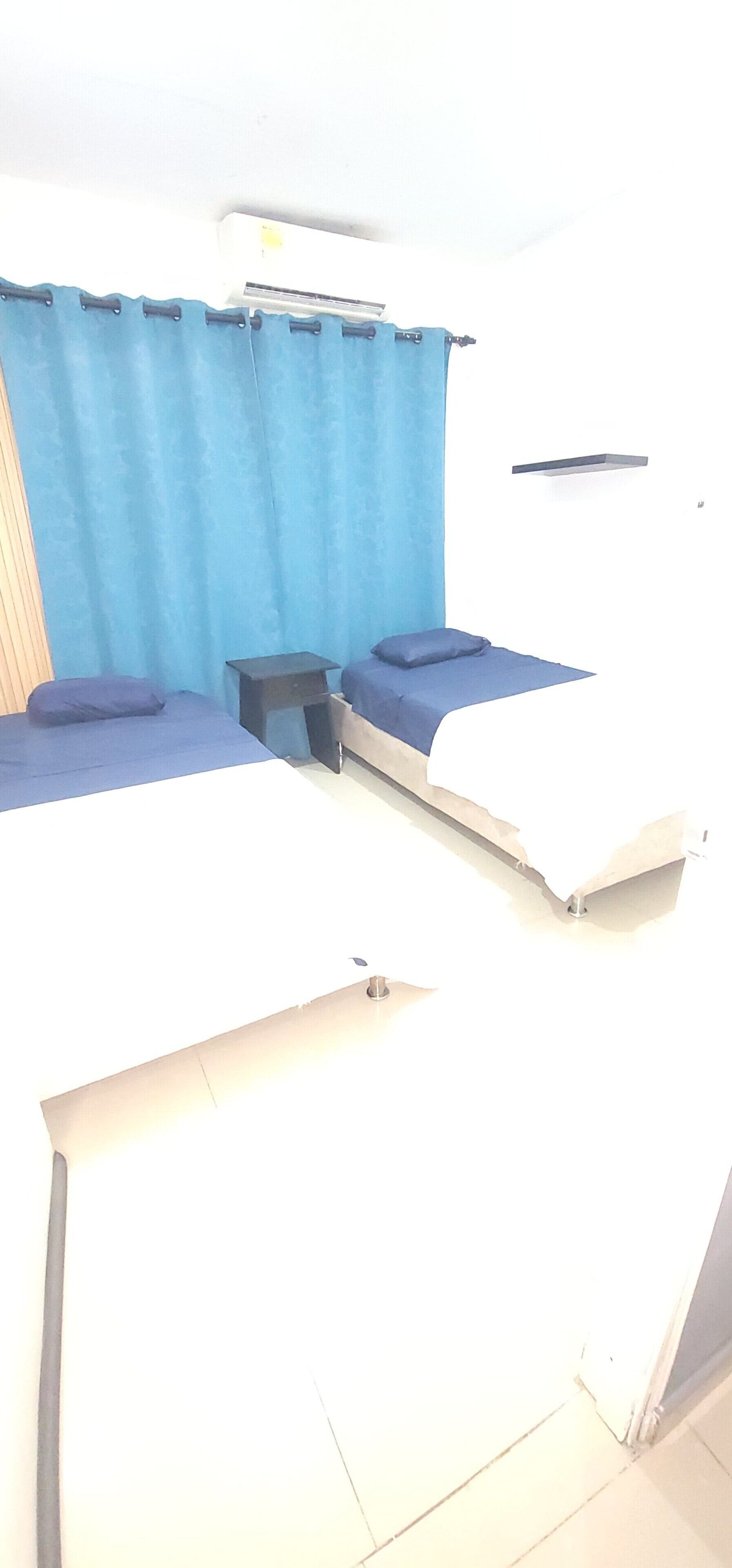 スタンダード ツインルーム 男女共用ドミトリー 専用バスルーム | 遮光カーテン、WiFi (無料)、ベッドシーツ