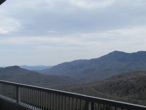 Enjoy breathtaking views of the surrounding mountains from this balcony.