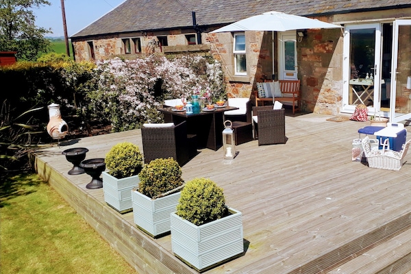 the South facing garden is completely private and enclosed