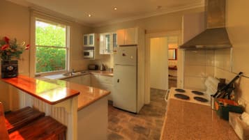 Family Cottage, 3 Bedrooms, 2 Bathrooms | Private kitchen | Full-sized fridge, microwave, oven, stovetop