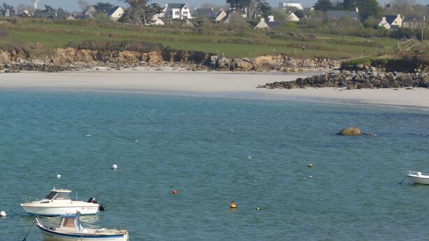 A coastal scene with a sandy beach, calm water, and several boats. - CHARACTER HOUSE: 28° covered SWIMMING POOL, SPA, JACCUZZI  (Plourin)