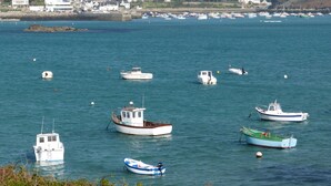 A coastal town with several boats anchored in the water. - CHARACTER HOUSE: 28° covered SWIMMING POOL, SPA, JACCUZZI  (Plourin)