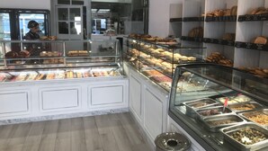 A bakery display with various baked goods.