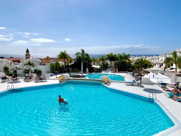 A heated pool, pool loungers