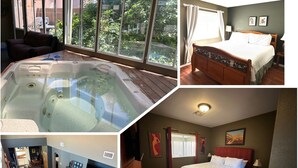 Ein Zimmer mit Whirlpool, einem Bett, einem Fernseher und einem Kamin.