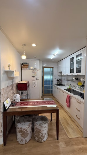 Fridge, microwave, coffee/tea maker, cookware/dishes/utensils
