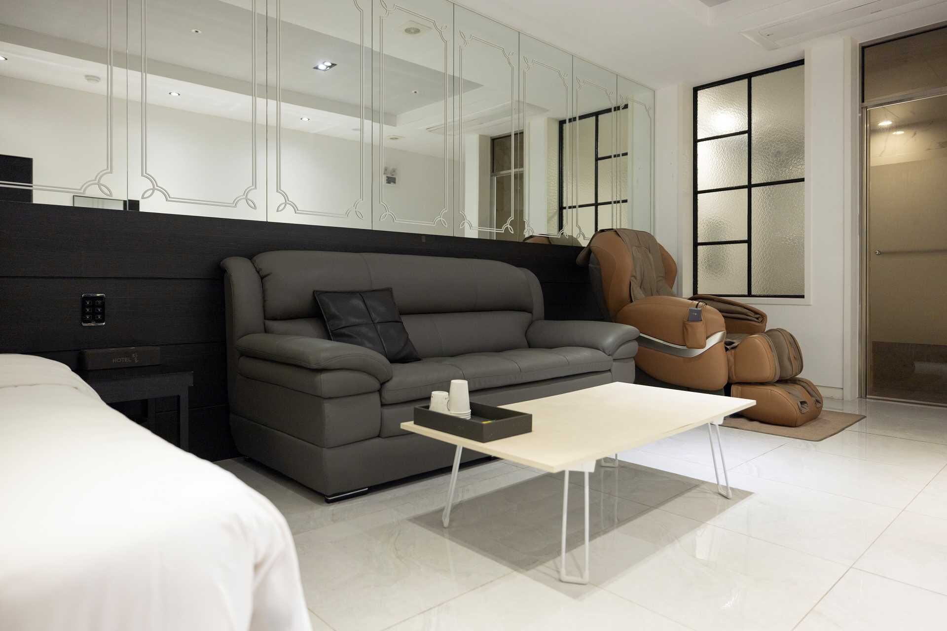 Deluxe Massage Chair | Premium bedding, desk, laptop workspace, blackout drapes