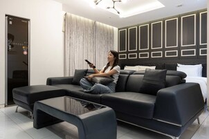 Suite | Premium bedding, desk, laptop workspace, blackout drapes