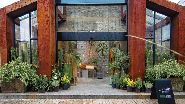 A modern building with large windows and a brick facade. - Shanghai Linxi Hotel-Free shuttle bus to Pudong Airport and Disneyland (Shanghai)