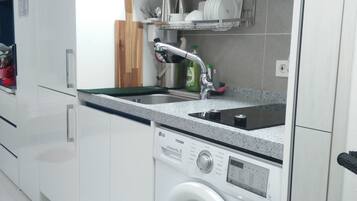 Fridge, microwave, electric kettle, cookware/dishes/utensils