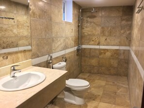 A bathroom with a sink, toilet, and shower. - Palmo Serviced Apartment 3 (Hanoi)
