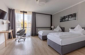 Dobbelt- eller tomannsrom – comfort | Skrivebord, ekstrasenger (mot et tillegg), wi-fi (inkludert) og sengetøy