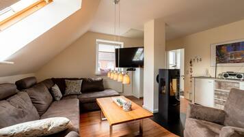 Exclusive Apartment (Lee) | Living area | Flat-screen TV, fireplace, DVD player, table tennis