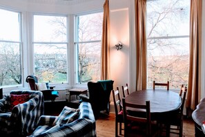 Enjoy a peaceful retreat with a bay window view of the surrounding tree-lined landscape.