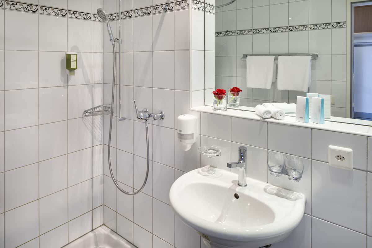 double room, patio, garden view | bathroom | shower, hair dryer, towels
