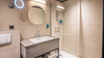 Shower, eco-friendly toiletries, hair dryer, towels