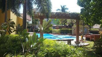 Outdoor pool, open 9:00 AM to 3:00 PM, pool umbrellas