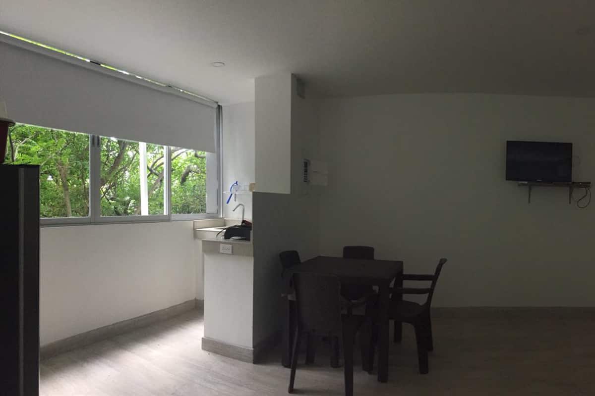 double room, multiple beds | living area | flat-screen tv