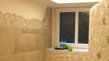 Features a stone mosaic design and a window with an outside view.