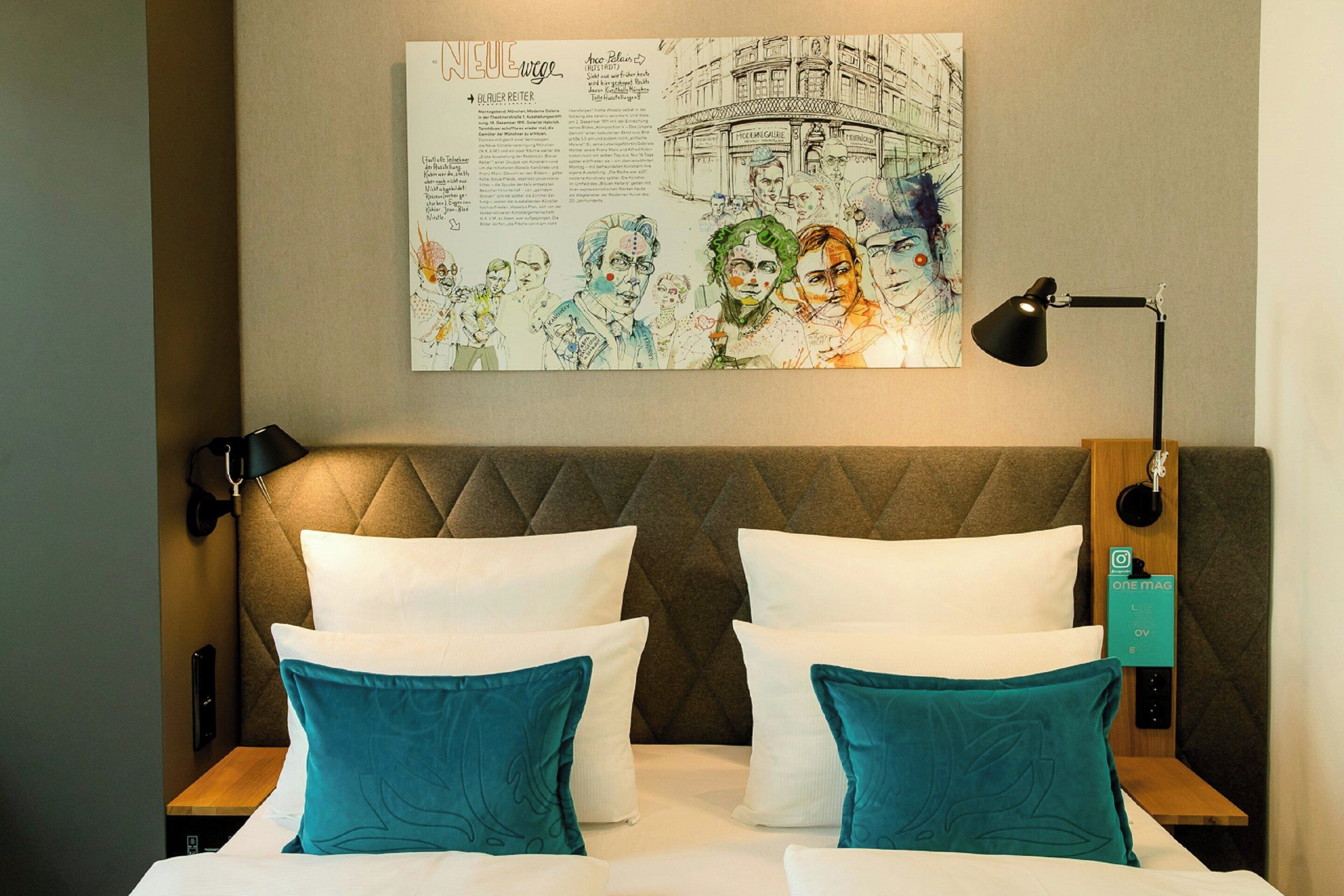 A hotel room with a large bed, two bedside tables, a headboard, and a wall-mounted artwork.