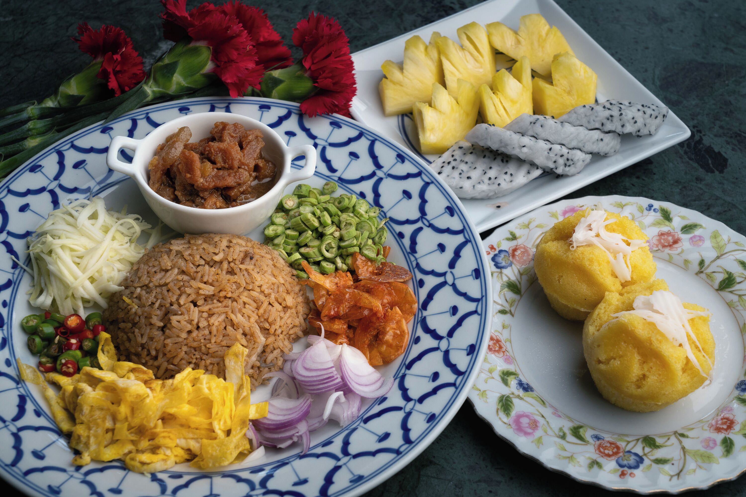 A plate of food with rice, vegetables, and meat.