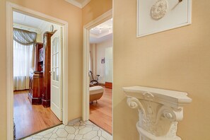 Traditional bathroom area with bathtub and toilet, featuring classic design and clean lines.