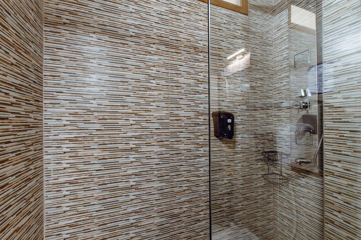 Suite, Ground Floor | Bathroom | Shower, hair dryer, bathrobes, slippers