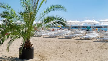 Sun-loungers, beach umbrellas, beach towels, beach volleyball