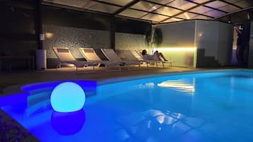 Indoor pool, pool umbrellas, pool loungers