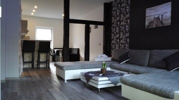 Apartment, 1 Bedroom (Alice) | Living area | Flat-screen TV