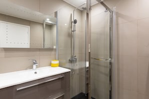 Bathtub, hair dryer, towels, soap