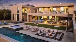 A modern two-story house with a swimming pool, outdoor seating, and a fire pit. - Ultra Luxury Modern Villa w/ Pickleball, Basketball, Soccer, Heated pool & Spa (Paradise Valley)