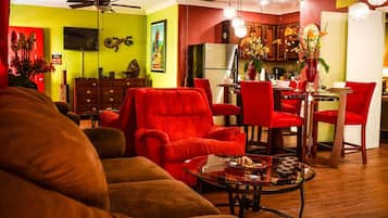 Deluxe Apartment, 1 Queen Bed, Kitchen | Living area | Flat-screen TV