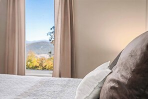 4 bedrooms, memory-foam beds, iron/ironing board, travel cot