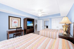 A hotel room with two beds, a desk, a chair, a television, and a ceiling fan. - Large Elegant Condo with Waterway View, Onsite Day Spa | Yacht Club Villas - 1-1004 (North Myrtle Beach)