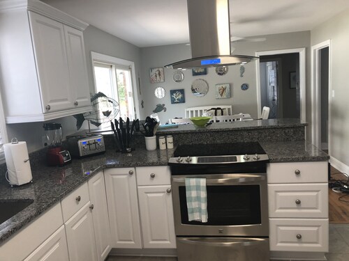 Fully Fenced in Backyard, 1 block to the beach, Golf Cart included,