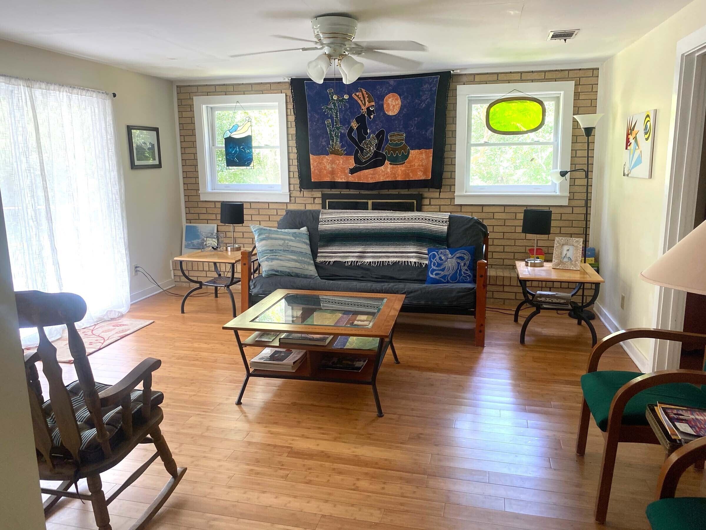 A comfortable home in a quiet neighborhood graced with Spanish Moss draped oaks.