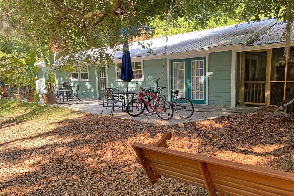 A comfortable home in a quiet neighborhood graced with Spanish Moss draped oaks.