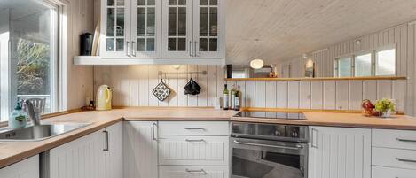 Fridge, stovetop, dishwasher, coffee/tea maker