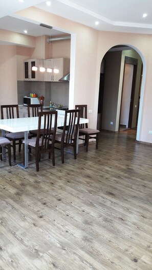 Standard Apartment, 3 Bedrooms | Living room | Flat-screen TV