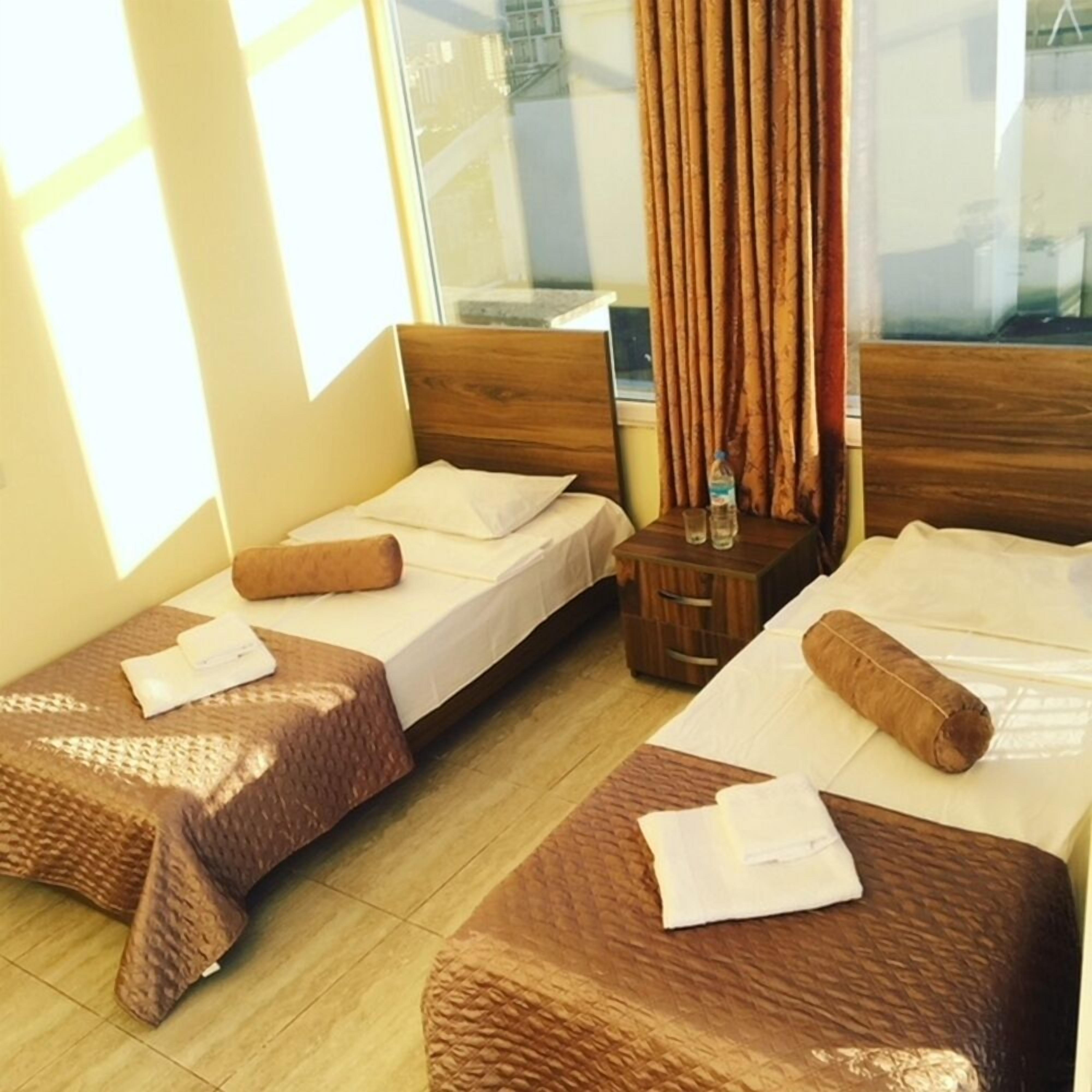 Standard Twin Room, Partial Sea View | Desk, iron/ironing board (on request), free WiFi, bed sheets