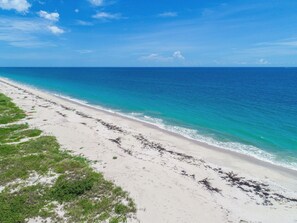 On the beach, sun loungers, beach umbrellas, beach towels