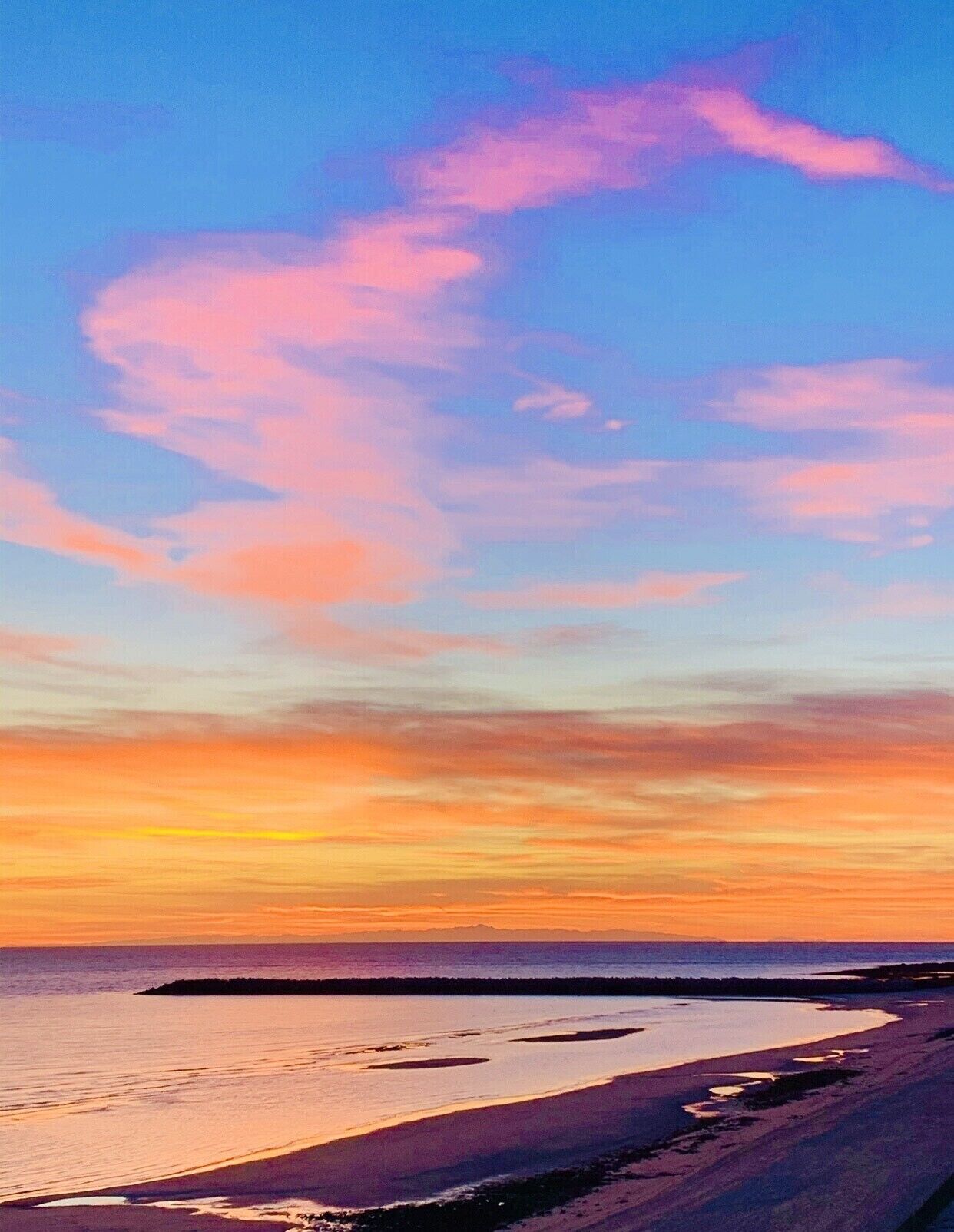 A beach with a sunset.