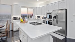 Coffee/tea maker, fridge, microwave, oven