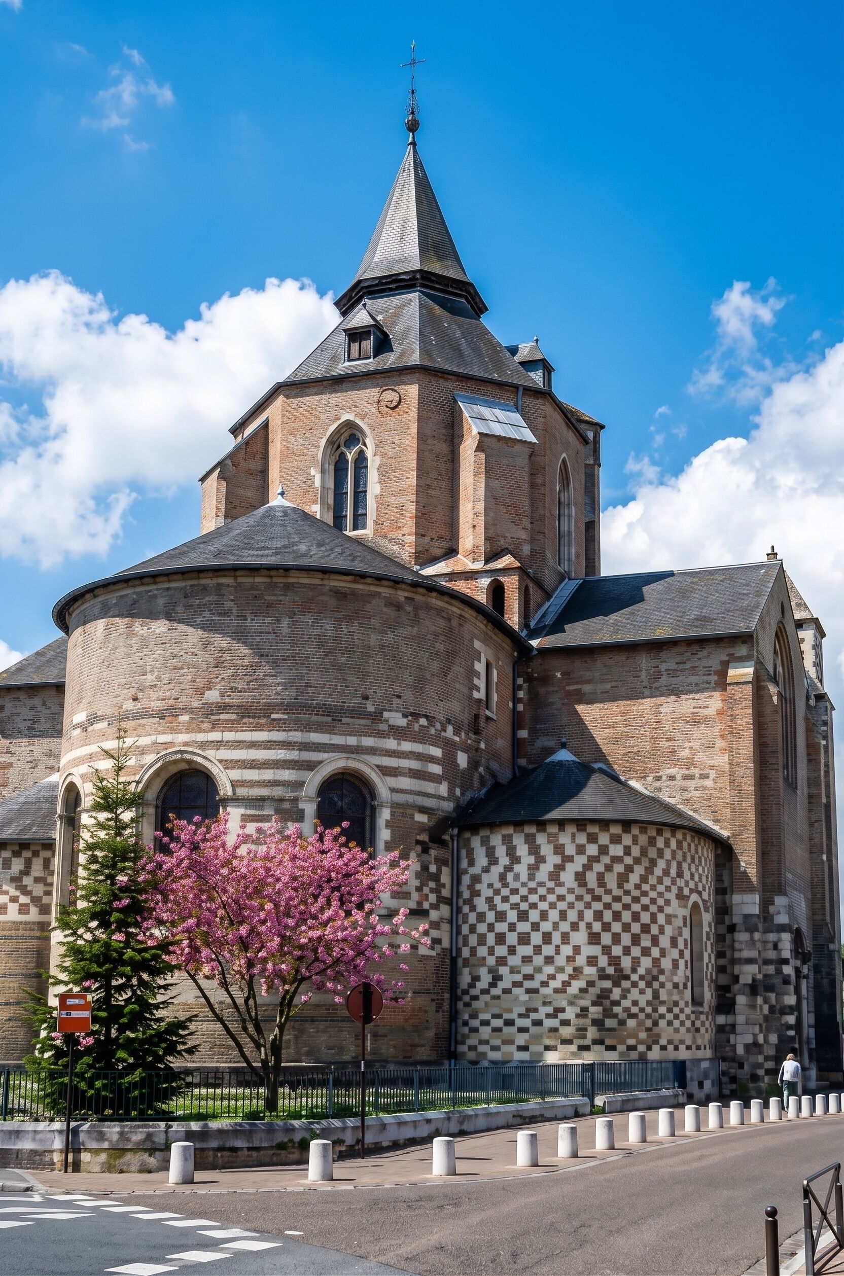 A historic church with a prominent tower and arched windows.
